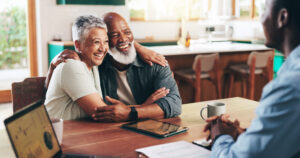 Successful meeting between older couple and financial advisor.